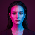 Portrait of a woman with an ambivalent, quietly defiant expression, illustrating the internal conflict behind self-sabotage